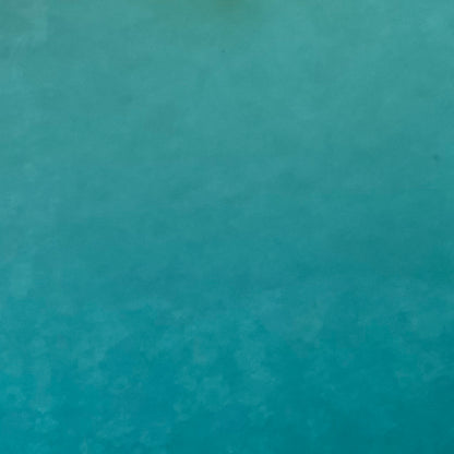 A sheet of Caribbean blue smooth fusible system 96 art glass.