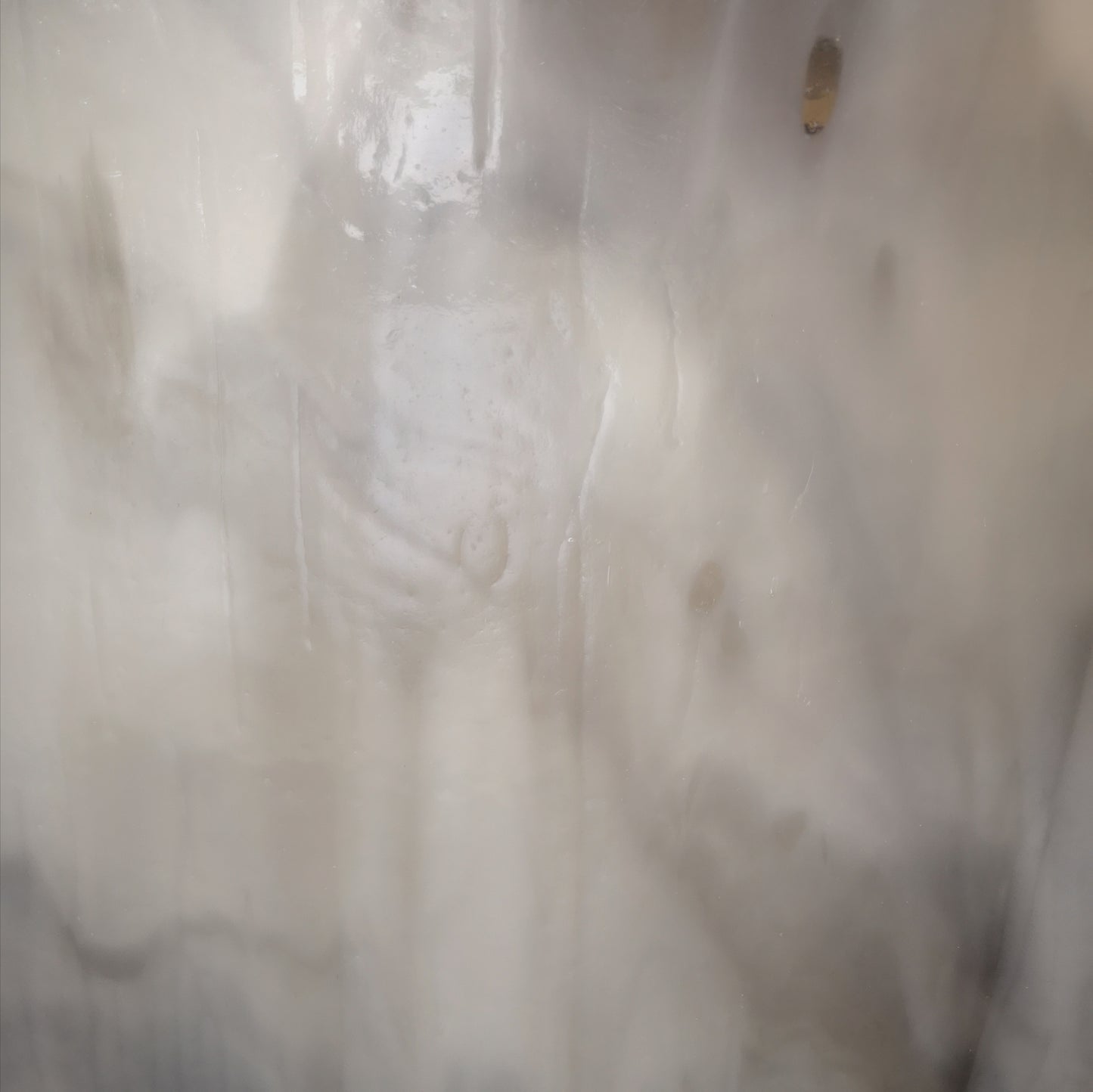 Grey and white stained glass sheet.