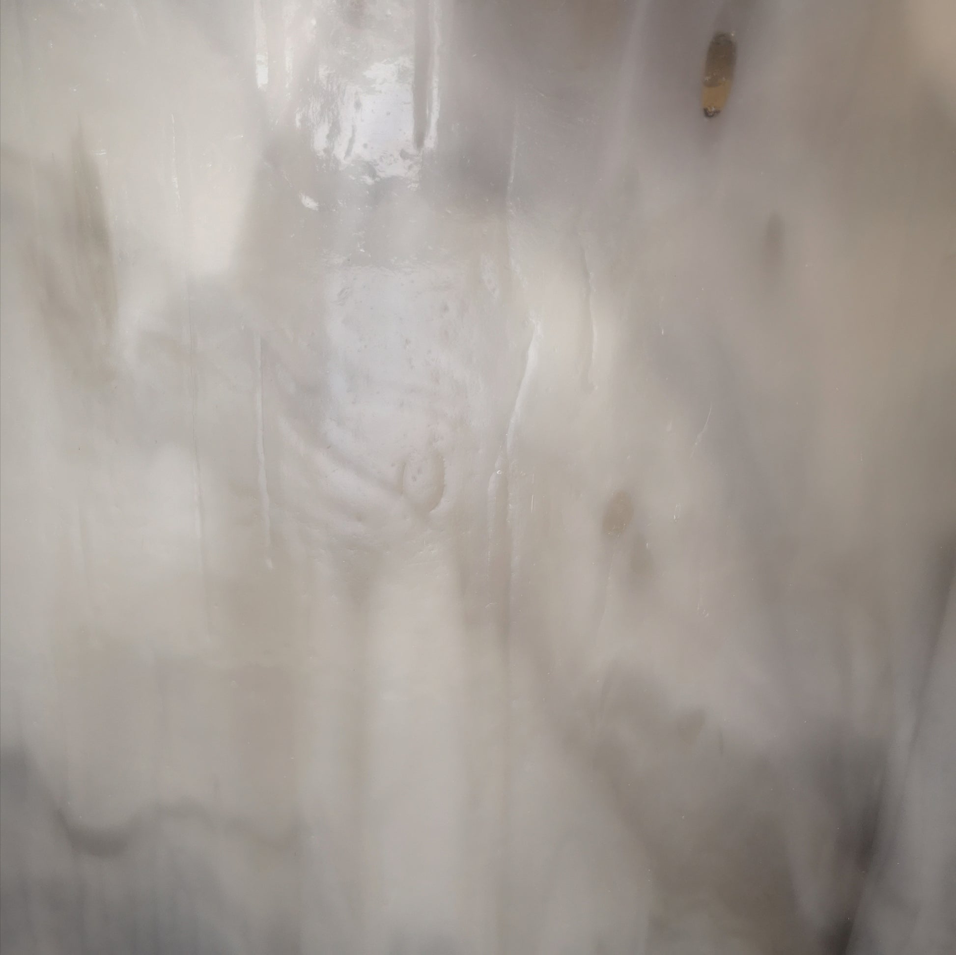 Grey and white stained glass sheet.