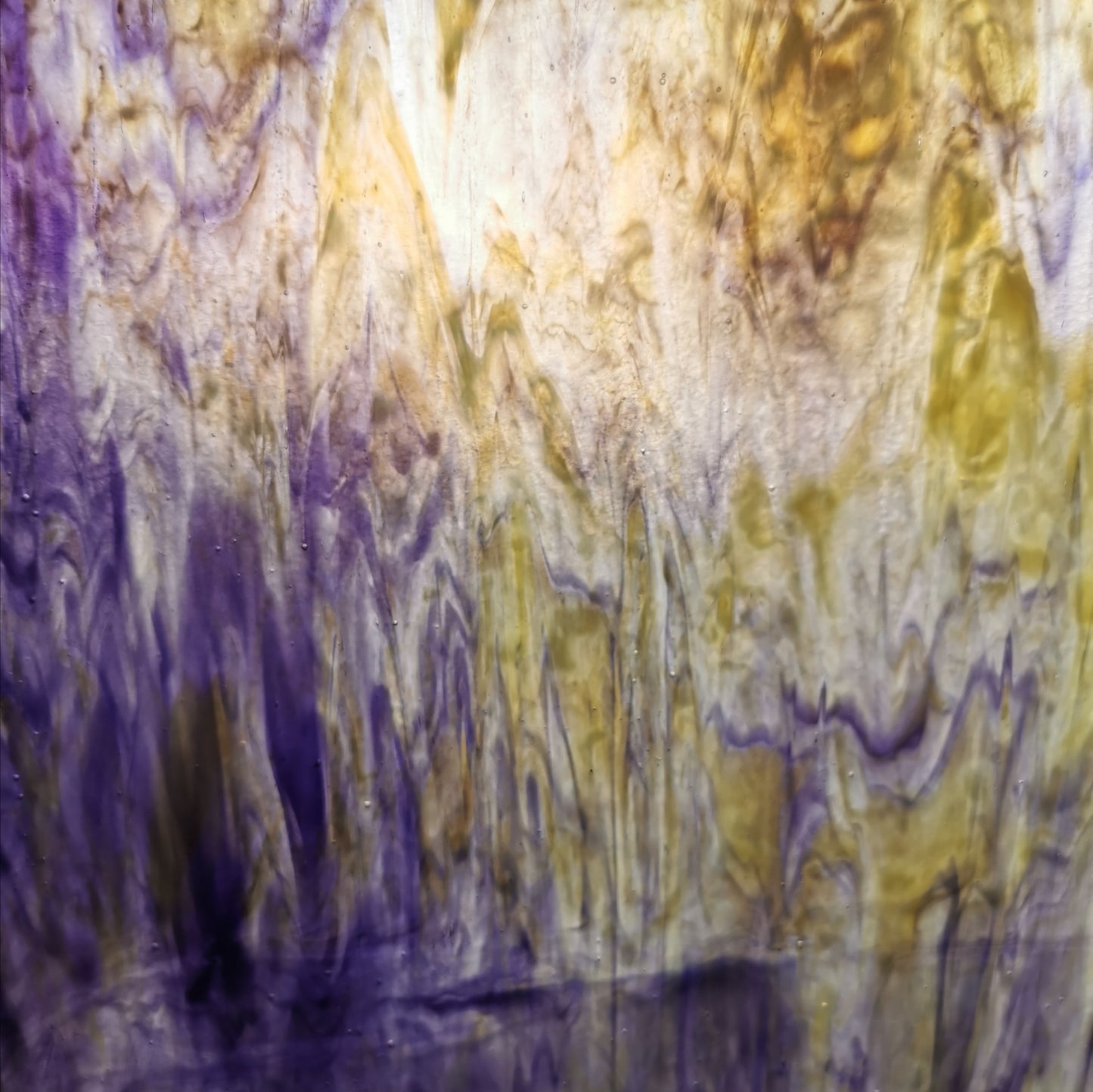 A yellow and purple sheet of stained glass.