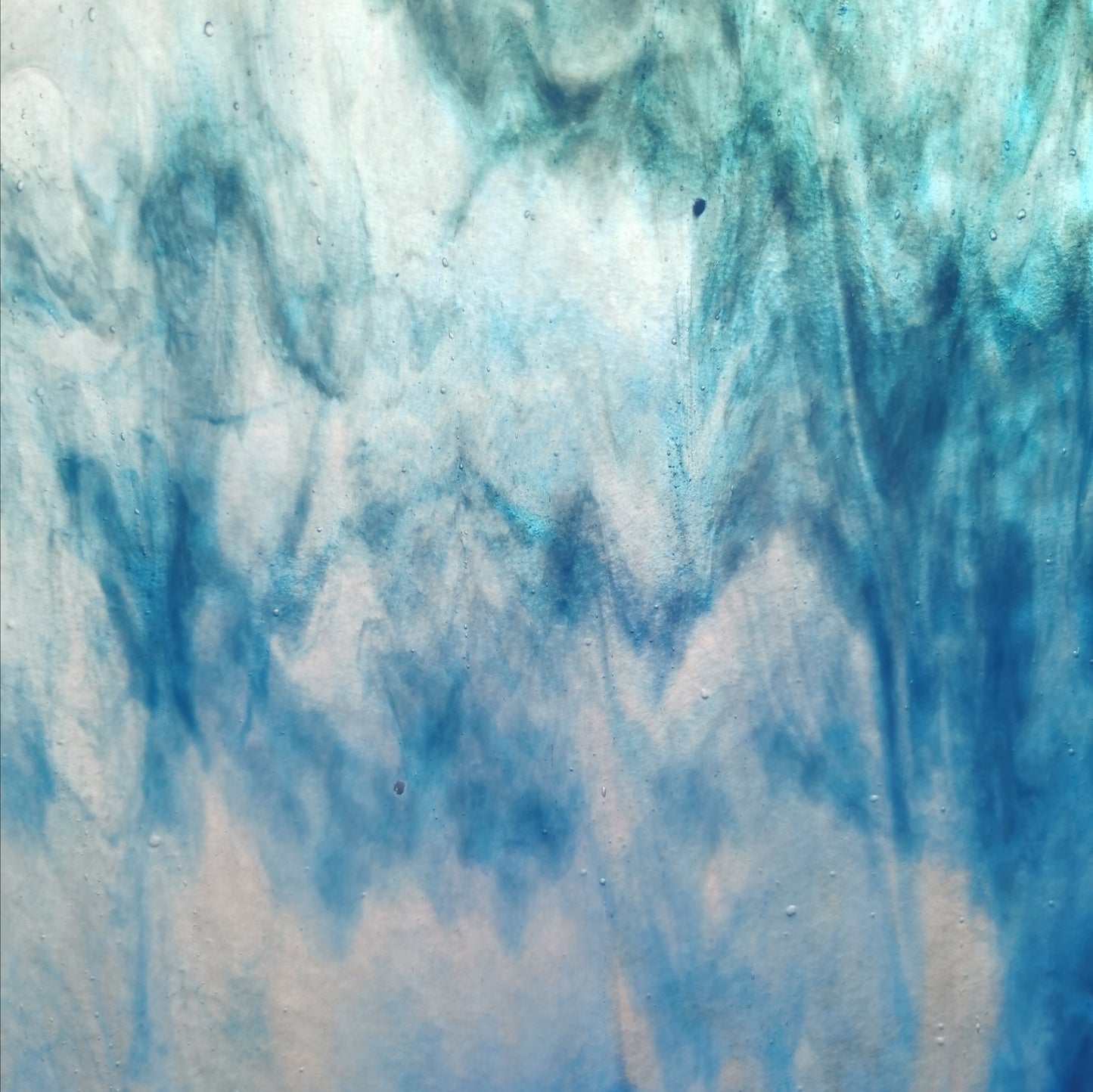 A photo of blue and white art glass.